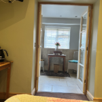 Double doors into bathroom